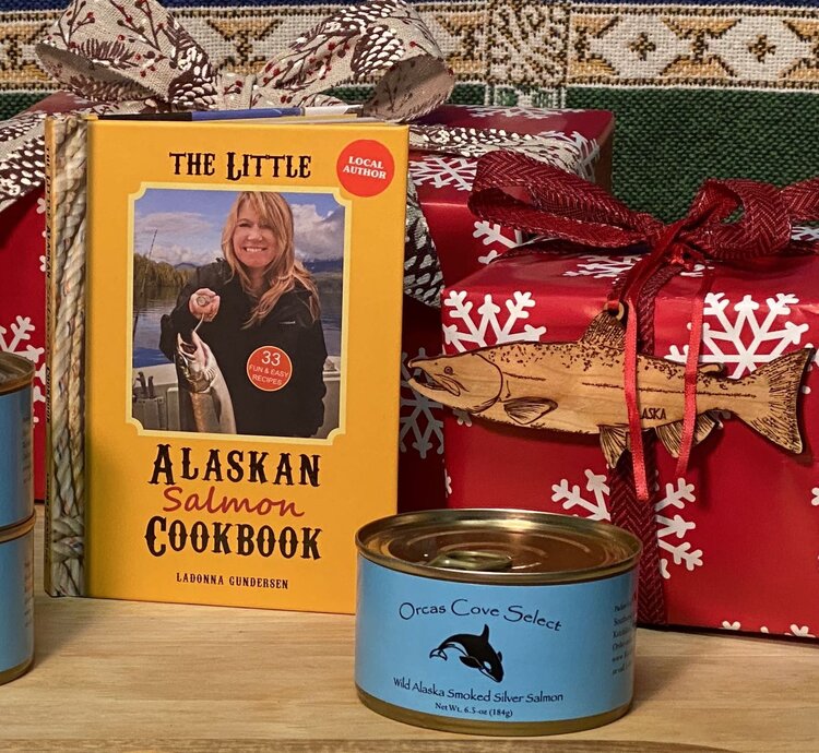 LilAlaskanCookBook a stack of flyers on a table