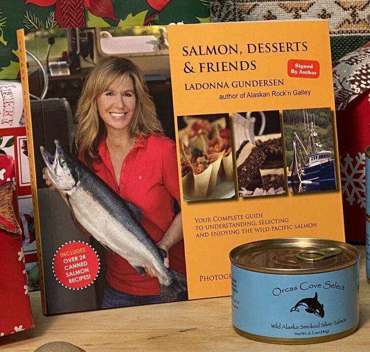 Salmondessertsandfriends a person holding a sign